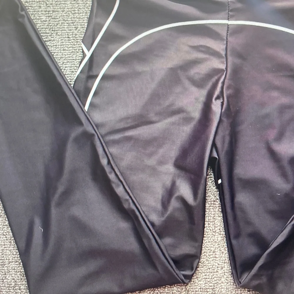 ALO Yoga Black Leggings with White Piping Detail